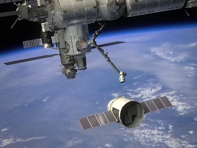 Dragon Cargo Ship Approaches the International Space Station