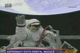 Chinese astronaut Zhai Zhigang waves from outside his Shenzhou 7 spacecraft September 27, 2008. He became his country's first spacewalker.