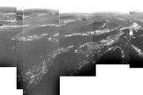 This first panorama of Titan released by ESA shows a full 360-degree view around the Huygens probe. The left-hand side shows a boundary between light and dark areas. The white streaks seen near this boundary could be ground 'fog', as they were not immediately visible from higher altitudes. Huygens drifted over a plateau (centre of image) and was heading towards its landing site in a dark area (right) during descent.