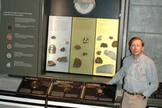 Orange County NSS member Robert Kline shows off one of the many displays on meteorites that he created for the refurbished Griffith Observatory. Credit Larry Evans
