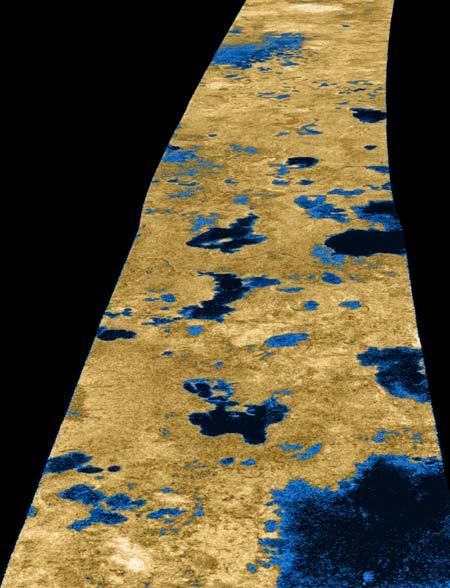 A false-color image of Titan's surface snapped by NASA's Cassini spacecraft on July 22, 2006. The lakes appear darker than the surrounding terrain because of the unique way they scatter radar, which is similar to how water lakes on Earth do it.