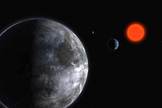 Artist's impression of the planetary system around the red dwarf Gliese 581. The five Earth-mass planet (seen in foreground - Gliese 581 c) is just inside the habitable zone.