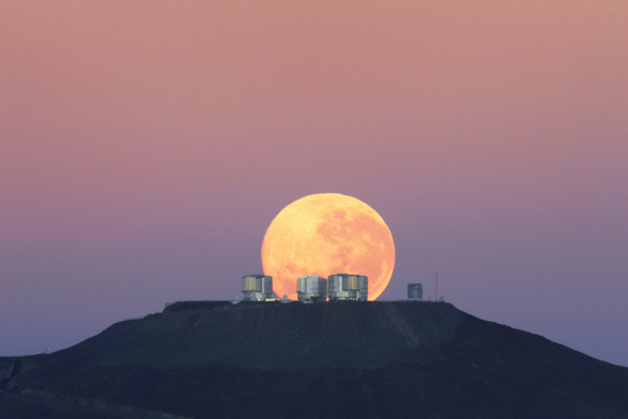 The dazzling full moon sets behind the Very Large Telescope in Chile's Atacama Desert in this photo released June 7, 2010 by the European Southern Observatory. The moon appears larger than normal due to an optical illusion of perspective. <a href=http://www.space.com/scienceastronomy/spectacular-moon-photo-over-chile-100609.html>Full Story</a>.