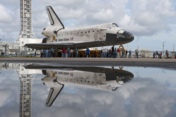 At NASA's Kennedy Space Center in Florida, shuttle Discovery pauses for photos during its move called "rollover" from Orbiter Processing Facility-3 to the nearby Vehicle Assembly Building (VAB) on Sept. 9, 2010.