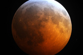 This photo of the total lunar eclipse of Dec. 20, 2010 by Jimmy Westlake shows the blue edge to Earth's shadow set against the reddened moon.