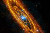 This image of the Andromeda Galaxy is a composite of an infrared photo from ESA's Herschel space telescope and the XMM-Newton’s X-ray telescope. The infrared frame shows rings of dust that trace gaseous reservoirs where new stars are forming and the X-ray image shows stars approaching the ends of their lives.