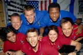 This image of the STS-107 shuttle Columbia crew in orbit was recovered from wreckage inside an undeveloped film canister. The shirt colors indicate their mission shifts. From left (bottom row): Kalpana Chawla, mission specialist; Rick Husband, commander; Laurel Clark, mission specialist; and Ilan Ramon, payload specialist. From left (top row) are astronauts David Brown, mission specialist; William McCool, pilot; and Michael Anderson, payload commander. Ramon represents the Israeli Space Agency.