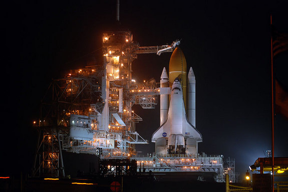 Space shuttle Discovery stands bathed in light ahead of its last launch into space on Feb. 24, 2011 on NASA's STS-133 mission.