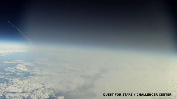 This frame grab from a video -- shot by a GoPro Hero Motorsport camera aboard the Robonaut-1 balloon -- shows the shuttle Discovery streaking toward space on its final mission. The shot was taken at 5:05 EST on Feb. 24, 2011 as the balloon was traveling through the troposphere -- hence the fog.