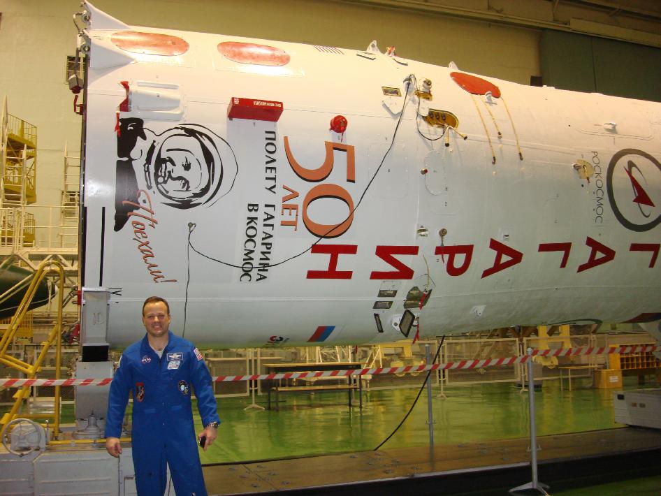 Astronaut Ron Garan with booster for