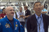 Endeavour shuttle commander Mark Kelly, left, and Nobel laureate Sam Ting (principal investigator for the Alpha Magnetic Spectrometer) look over the instrument as it sits in a work stand at NASA's Kennedy Space Center in Florida. Kelly will command the STS-134 mission to take the AMS to the International Space Station. The cutting edge instrument is the brainchild of Ting.