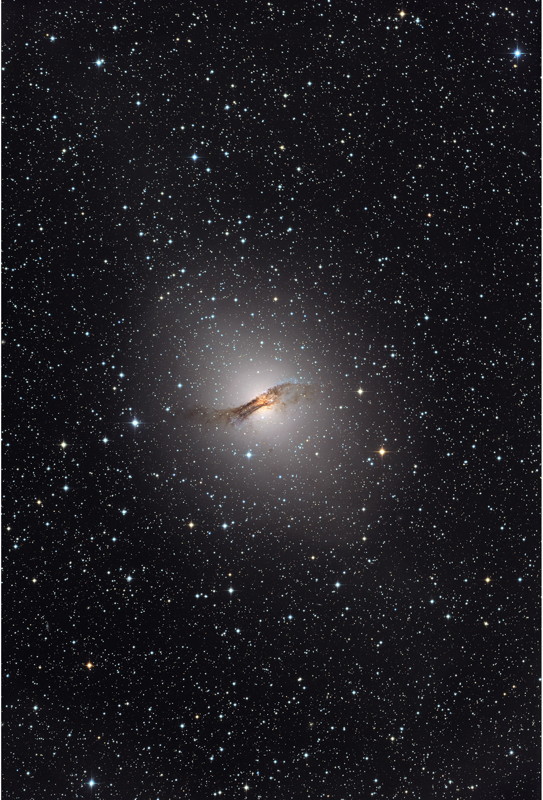 The elliptical galaxy NGC 5128, host of the Centaurus A radio source, as it appears in visible light. The galaxy is located about 12 million light-years away and is one of the closest that sports an active supermassive black hole