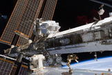 The powerful Alpha Magnetic Spectrometer-2 (AMS) is visible at center left. The blackness of space and Earth's horizon provide the backdrop for the scene, on May 20, 2011 (Flight Day 5 of the STS-134 shuttle mission).