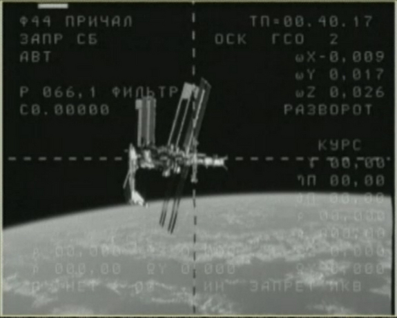 This still from NASA TV shows the space shuttle Endeavour (at left) while it is docked at the International Space Station on May 23, 2011 during the shuttle's final spaceflight before being retired. A video camera on a Russian Soyuz spacecraft caught this view just after undocking. An astronaut on the Soyuz snapped more photos and video of the unprecedented sight at the International Space Station.