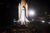 Bright xenon lights flare while space shuttle Atlantis rolls down a 3.4-mile stretch of river rocks, as the vehicle embarks on its historic final journey from the Vehicle Assembly Building to Launch Pad 39A at NASA's Kennedy Space Center in Florida, on May 31, 2011.