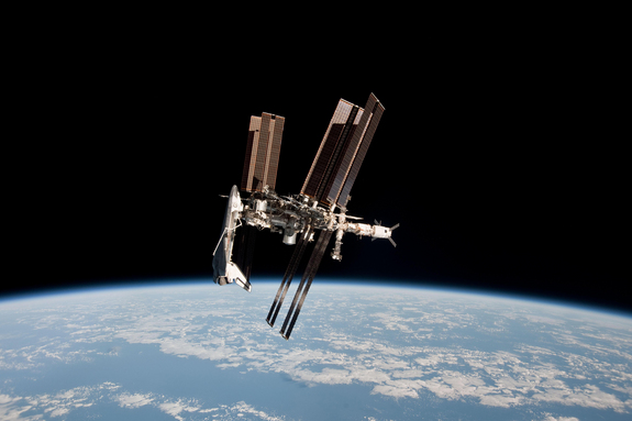 The space shuttle Endeavour and International Space Station shine front and center in this amazing (and historic) photo of the two vehicles docked together as seen from a Russian Soyuz spacecraft. Astronaut Paolo Nespoli snapped this view and others during the first-ever photo session of a shuttle docked at the space station.
