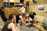 Members of the Mars500 crew prepare an EEG recording. EEG (electroencephalography) is a recording of electrical activity along the scalp produced by the firing of neurons within the brain).