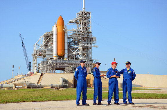 NASA's final space shuttle crew took part in a press conference on June 22, 2011 while standing behind their spacecraft, Atlantis, and Kennedy Space Center's Launch Pad 39A. From left to right: STS-135 mission specialists Rex Walheim, Sandra Magnus, pilot Doug Hurley and commander Chris Ferguson.