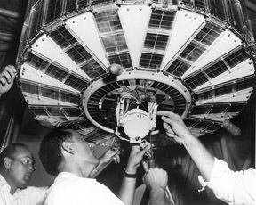 Technicians work on nuclear generator attached to Transit 4A.