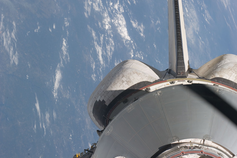 Atlantis and Raffaello Multi-purpose Logistics Module Backdropped by Earth,