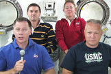 The STS-135 shuttle crew gathers in the Kibo module of the International Space Station to talk to reporters Thursday, July 14, 2011 during NASA's final shuttle flight. From left to right are Commander Chris Ferguson, Mission Specialists Rex Walheim and Sandy Magnus and Pilot Doug Hurley.