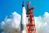 This image shows the launch of Friendship 7, the first American manned orbital space flight. With astronaut John Glenn aboard, the Mercury-Atlas rocket is launched from Pad 14, February 20, 1962.