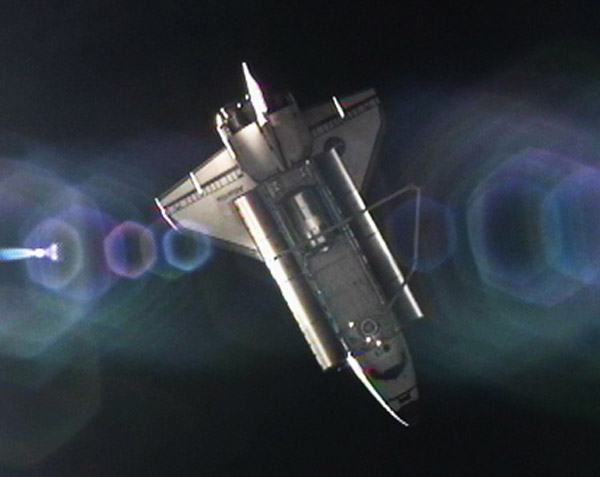 Shuttle Atlantis Undocks from Space Station for Last Time
