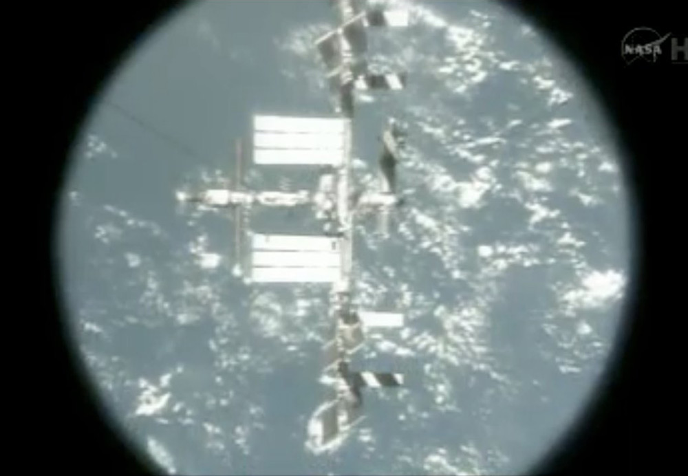 The International Space Station as Seen Through an Atlantis Porthole