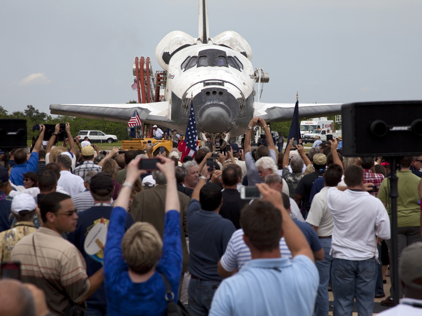Space shuttle Atlantis is slowly towed from the Shuttle Landing Facility to an orbiter processing facility at NASA's Kennedy Space Center in Florida for the last time.