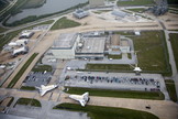 At NASA's Kennedy Space Center in Florida, space shuttles Discovery and Endeavour part company outside Orbiter Processing Facility-3 (OPF-3) where they paused for a unique "nose-to-nose" photo opportunity.