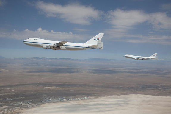 NASA's modified Boeing 747 Shuttle Carrier Aircraft briefly flew in formation over the Edwards Air Force Base Test Range on Aug. 2, 2011.