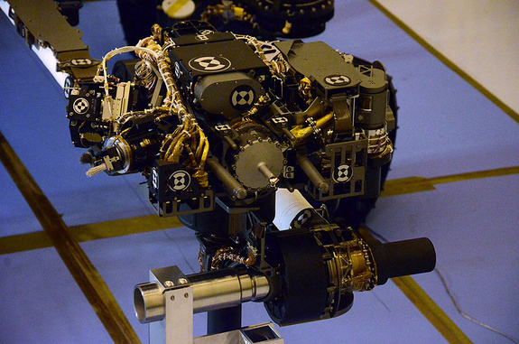 At the end of Curiosity's seven-foot arm is a turret, shaped like a cross. This turret, a hand-like structure, holds various tools that can spin through a 350-degree turning range. At the tip of the arm is the turret structure on which five devices are mounted. Two of these devices are in-situ or contact instruments known as the Alpha Particle X-ray Spectrometer (APXS) and the Mars Hand Lens Imager. The remaining three devices are associated with sample acquisition and sample preparation functions.