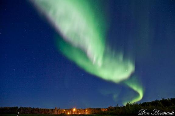 A twisting ribbon of bright green light dominates this view of the dazzling Sept. 9, 2011 northern lights display captured by photographer and skywatcher Don Arsenault in northern Alberta, Canada.