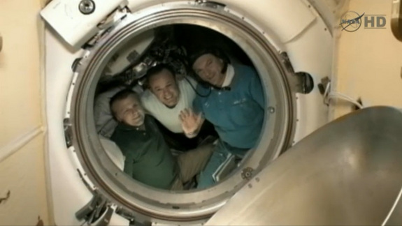 American astronaut Ron Garan (center) and his two Russian crewmates Alexander Samokutyaev (waving) and Andrey Borisenko bid farewell to the International Space Station on Sept. 15, 2011 before undocking from the outpost and returning to Earth.