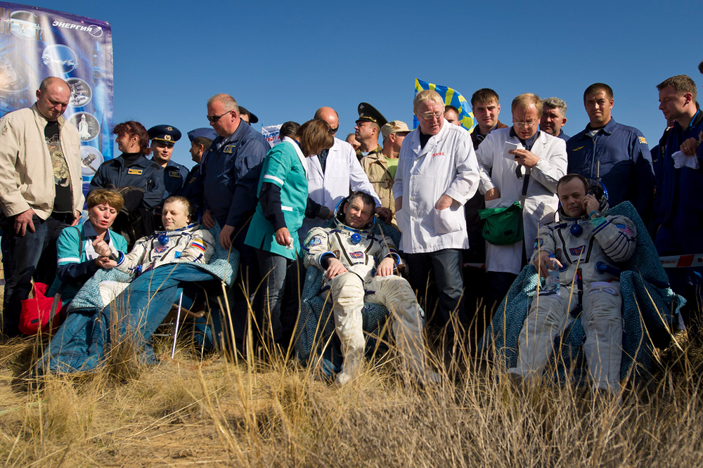 Expedition 28 Crew in Chairs on the Ground