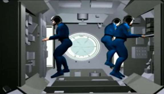 This image depicts a full crew of three astronauts inside China's first space laboratory, the Tiangong 1.