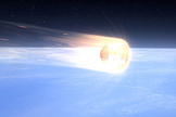 Artist’s rendition of Dragon, thermally protected by SpaceX’s PICA-X advanced heat shield, reentering Earth’s atmosphere.