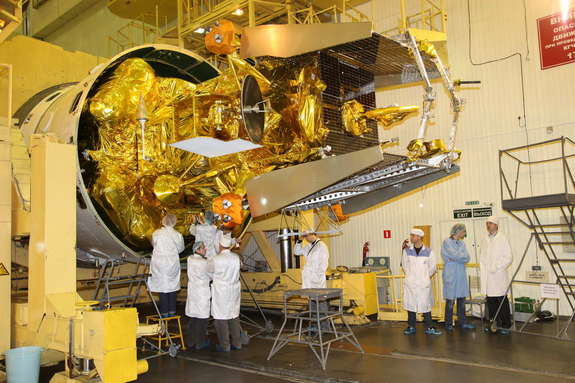 Russian space engineers seal the Mars Phobos-Grunt spacecraft inside its Zenit 3SL rocket nosecone for a Nov. 2011 launch toward the Red Planet to explore Mars and its moon Phobos.