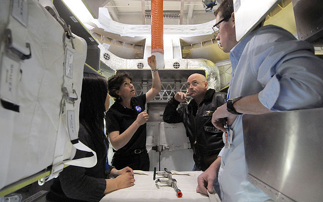Astronauts Cady Coleman and Scott Kelly Visit the Dragon Capsule