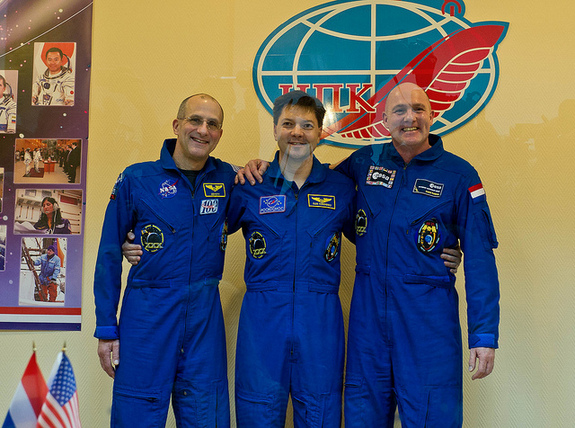 Expedition 30/31 crew members from left: NASA Flight Engineer Don Pettit, Soyuz Commander Oleg Kononenko and European Space Agency Flight Engineer Andre Kuipers are seen following a press conference held at the Cosmonaut Hotel on Dec. 20, 2011, in Baikonur, Kazakhstan.