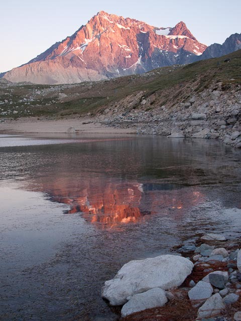 At sunset, the normally gray Meson Alto, the mountain that dominates the view to the east of Laguna Negra, glows with color.