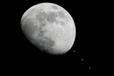 Multiple images of the International Space Station flying over the Houston area have been combined into one composite image to show the progress of the station as it crossed the face of the moon in the early evening of Jan. 4, 2012.