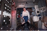 During off-duty time in the Spacehab Module, astronaut Shannon W. Lucid uses the microgravity of space to fabricate her own kind of easy chair as the days of her lengthy Russian Mir Space Station stay as a cosmonaut guest researcher come to a close in September 1996.