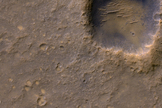 Near the lower left corner of this view is the three-petal lander platform (circled) that NASA's Mars Exploration Rover Spirit drove off in January 2004.