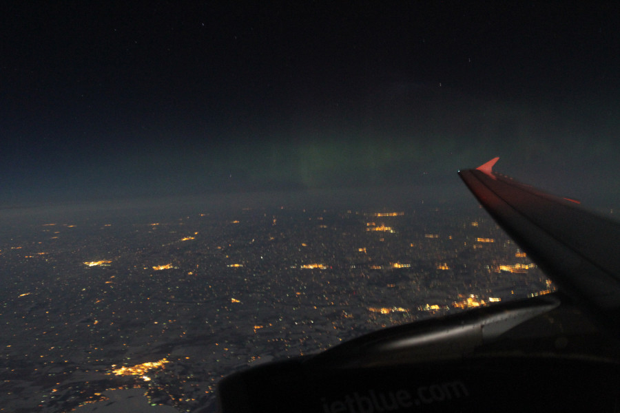 Aurora Viewed Through an Airplane Window
