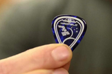 A close-up of the cosmic guitar pick to be used by Canadian astronaut Chris Hadfield during his Expedition 35 mission to the International Space Station in late 2012 and early 2013. The pick resembles Hadfield's Expedition 35 mission patch.