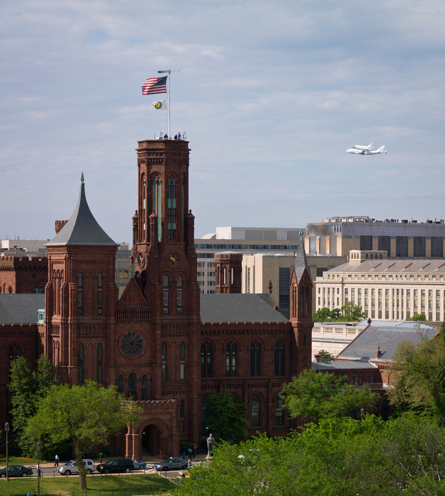 Shuttle Discovery Flies Over Smithsonian Castle