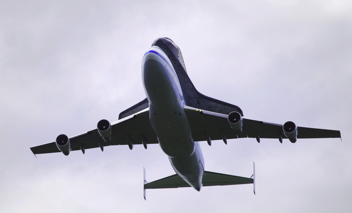 Discovery and Shuttle Carrier Aircraft Flying Overhead