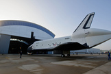 Space Shuttle Enterprise rolls from the Space Hangar at the Steven F. Udvar-Hazy Center prior to a transfer ceremony, Thursday, April 19, 2012, in Chantilly, Va.