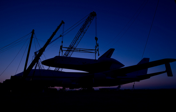 The prototype space shuttle Enterprise is seen in silhouette after it was mated on top of the NASA 747 Shuttle Carrier Aircraft (SCA) at Washington Dulles International Airport, Friday, April 20, 2012, in Sterling, Va. Enterprise will go on permanent display at the Intrepid Sea Air and Space Museum in New York in June.